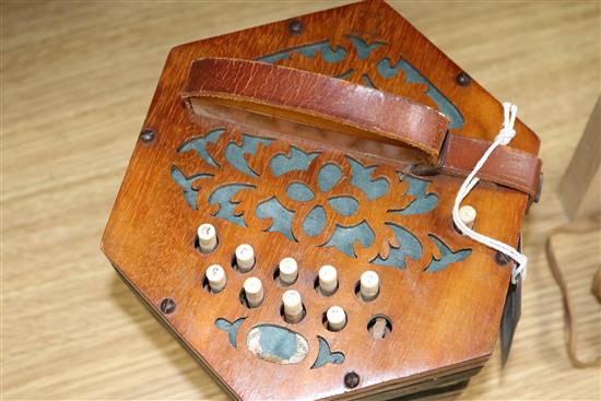 A 21-button Concertina Superior, possibly German, with fret-cut ends (faults, no case)